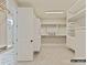 Walk-in closet with built-in shelving, drawers, and ample storage space; adjacent bathroom at 1001 Kingbird Ln # 15, Clover, SC 29710