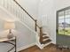 Welcoming entryway featuring a staircase, wood flooring, and a glass paneled front door at 1001 Kingbird Ln # 15, Clover, SC 29710