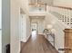 Inviting foyer with hardwood floors, staircase, and stylish console table, showcasing the home's elegance at 1001 Kingbird Ln # 15, Clover, SC 29710