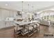 Open kitchen features a large island with seating, stainless appliances, and hardwood flooring at 1001 Kingbird Ln # 15, Clover, SC 29710