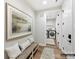Bright laundry room featuring front load machines, artwork, wooden bench, and neutral decor at 1001 Kingbird Ln # 15, Clover, SC 29710