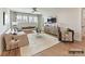 Bright and airy living room with hardwood floors, neutral furniture, and a modern ceiling fan at 1001 Kingbird Ln # 15, Clover, SC 29710