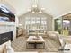 Living room featuring a fireplace, contemporary lighting, and large windows with views of the backyard at 1001 Kingbird Ln # 15, Clover, SC 29710