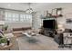 Cozy living room with a large television, comfortable seating, and natural light from shuttered windows at 1001 Kingbird Ln # 15, Clover, SC 29710