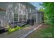 Backyard with outdoor seating and well-maintained landscaping provides a relaxing outdoor experience at 10044 Markus Dr, Mint Hill, NC 28227