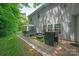 Backyard with a hot tub, outdoor seating, and well-maintained landscaping provides a relaxing outdoor experience at 10044 Markus Dr, Mint Hill, NC 28227