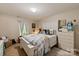 Cozy bedroom with a white wooden bedframe, dresser, and plush toys offers a comfy retreat at 10044 Markus Dr, Mint Hill, NC 28227