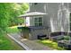 Backyard featuring a hot tub, outdoor seating, and a well-kept lawn for relaxation and entertaining at 10044 Markus Dr, Mint Hill, NC 28227