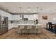 Bright kitchen featuring stainless steel appliances, a large island, and bar stool seating at 10044 Markus Dr, Mint Hill, NC 28227