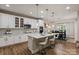 Bright kitchen featuring stainless steel appliances, a large island, and bar stool seating at 10044 Markus Dr, Mint Hill, NC 28227