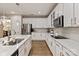 Modern kitchen with stainless steel appliances, white cabinets, and marble countertops at 10044 Markus Dr, Mint Hill, NC 28227