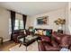 Cozy living room features comfortable seating and natural light from windows with elegant curtains at 10044 Markus Dr, Mint Hill, NC 28227