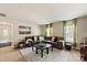 Spacious living area with a plush area rug, comfy seating, and great natural light at 10044 Markus Dr, Mint Hill, NC 28227