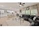 Bright living room with an open-concept design, large windows, and a view of the modern kitchen at 10044 Markus Dr, Mint Hill, NC 28227