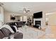 Spacious living room with a fireplace, plush seating, and a large television at 10044 Markus Dr, Mint Hill, NC 28227