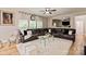 Comfortable living room with a fireplace, plush seating, and a view of the open-concept kitchen at 10044 Markus Dr, Mint Hill, NC 28227