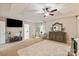 Bright main bedroom featuring a ceiling fan, carpet, and well-placed furniture for a comfortable retreat at 10044 Markus Dr, Mint Hill, NC 28227