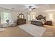 Spacious main bedroom with a ceiling fan, carpeted floors, and a relaxing atmosphere at 10044 Markus Dr, Mint Hill, NC 28227