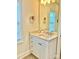 This bathroom has a white vanity with bronze hardware and granite countertops at 1025 N Sharon Amity Rd, Charlotte, NC 28211