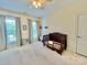 Carpeted bedroom featuring two windows and a small bed at 1025 N Sharon Amity Rd, Charlotte, NC 28211