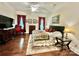 Charming bedroom with hardwood floors, natural light, and stylish decor, offering a relaxing and comfortable space at 1025 N Sharon Amity Rd, Charlotte, NC 28211
