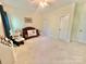 Carpeted bedroom featuring two windows, a crib, and a chair at 1025 N Sharon Amity Rd, Charlotte, NC 28211