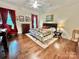 Spacious bedroom with hardwood floors, large windows, and elegant furnishings, providing a luxurious and serene retreat at 1025 N Sharon Amity Rd, Charlotte, NC 28211