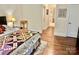 Bedroom featuring hardwood floors, with bathroom access and natural light, creating a warm and inviting atmosphere at 1025 N Sharon Amity Rd, Charlotte, NC 28211