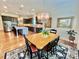 Elegant dining room adjacent to the kitchen, featuring a chandelier and hardwood floors at 1025 N Sharon Amity Rd, Charlotte, NC 28211