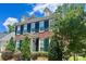 Beautiful two-story brick home with lush landscaping in a residential neighborhood at 1025 N Sharon Amity Rd, Charlotte, NC 28211