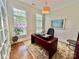 Bright home office features natural light, a modern desk, and refined decor at 1025 N Sharon Amity Rd, Charlotte, NC 28211