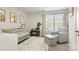 Cozy Bedroom with crib, glider, and natural light, perfect for a baby's room at 1028 Maltby St, Charlotte, NC 28217