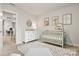Well-decorated Bedroom featuring a crib, dresser, and whimsical artwork at 1028 Maltby St, Charlotte, NC 28217