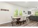 Dining area adjacent to the living room, featuring lots of light and modern flooring at 1028 Maltby St, Charlotte, NC 28217