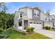 Charming two-story home with stone accents, neutral siding, a two car garage and manicured landscaping at 1028 Maltby St, Charlotte, NC 28217