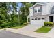 Charming two-story home with stone accents, neutral siding, a two car garage, and a nice yard at 1028 Maltby St, Charlotte, NC 28217