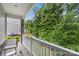 Inviting covered porch with chairs and a view of the green space at 1028 Maltby St, Charlotte, NC 28217