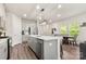 Bright kitchen with island seating, stainless steel dishwasher, and dining table visible at 1028 Maltby St, Charlotte, NC 28217