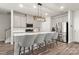 Modern kitchen with a large island, stainless steel appliances, and gray bar stool seating at 1028 Maltby St, Charlotte, NC 28217