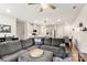 Open-concept living room flows into the kitchen and dining area, featuring a comfortable gray sofa at 1028 Maltby St, Charlotte, NC 28217