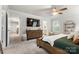 Comfortable main bedroom with walk-in closet, ceiling fan, and natural light at 1028 Maltby St, Charlotte, NC 28217