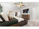 Comfortable main bedroom with walk-in closet, ceiling fan, and neutral colors at 1028 Maltby St, Charlotte, NC 28217