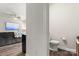 View from Gathering room into a modern powder room with clean, minimalist design at 1028 Maltby St, Charlotte, NC 28217