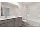 Bathroom features a double sink vanity, a bathtub with shower, and sleek fixtures offering a blend of style and functionality at 1039 20Th Avenue Se Loop, Hickory, NC 28602