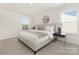 Inviting bedroom features a large bed, neutral tones, bedside tables, and bright windows to create a comfortable retreat at 1039 20Th Avenue Se Loop, Hickory, NC 28602