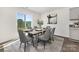 Bright dining room with a sliding glass door and an adjacent outdoor view at 1039 20Th Avenue Se Loop, Hickory, NC 28602