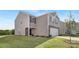 Exterior view of a two-story home with neutral siding and a front entry door with a black finish at 1039 20Th Avenue Se Loop, Hickory, NC 28602