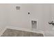 Neutral-colored laundry room with tile floors, offering functionality and efficiency for laundry tasks with hookups and a door at 1039 20Th Avenue Se Loop, Hickory, NC 28602