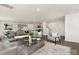 Open floor plan showcases a kitchen and living space with sleek decor, furniture, and lots of light at 1039 20Th Avenue Se Loop, Hickory, NC 28602