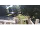 Backyard featuring mature trees and a parking structure at 105 N Central Ave, Belmont, NC 28012
